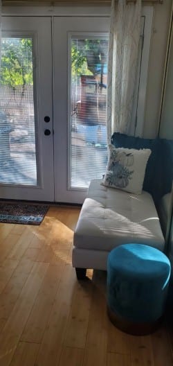 Sitting area with a chaise lounge by French doors