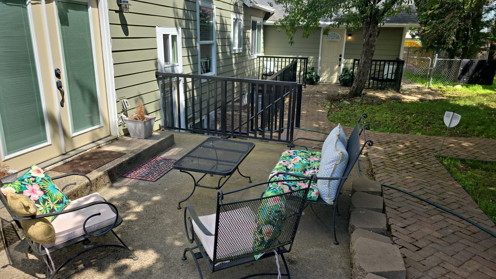 Back patio with wrought-iron seating