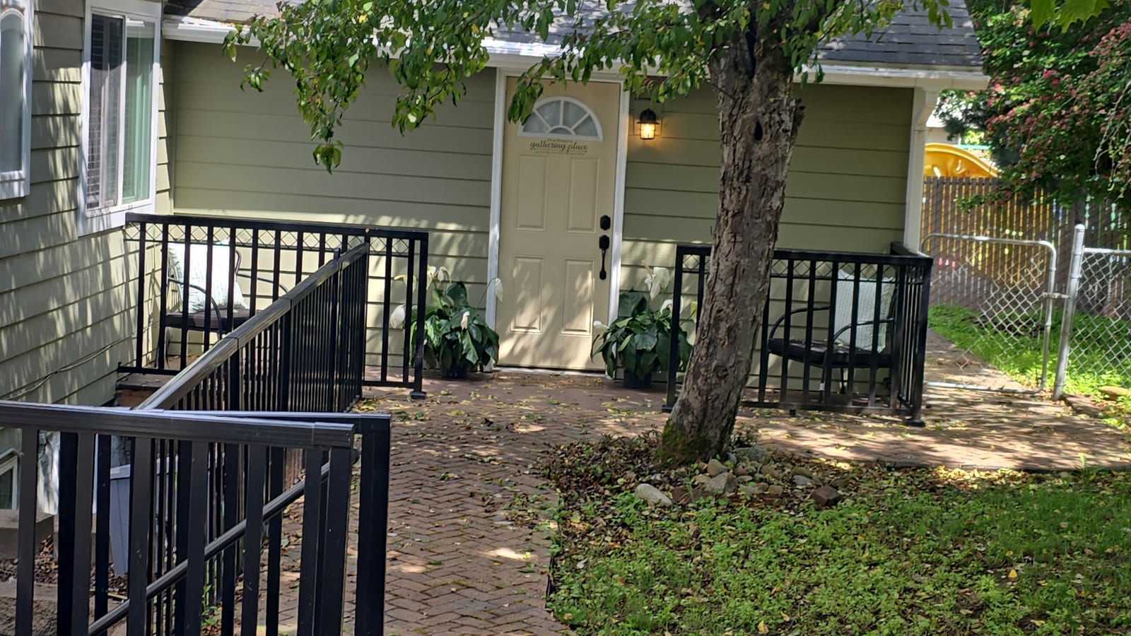 Back entrance with an accessibility ramp